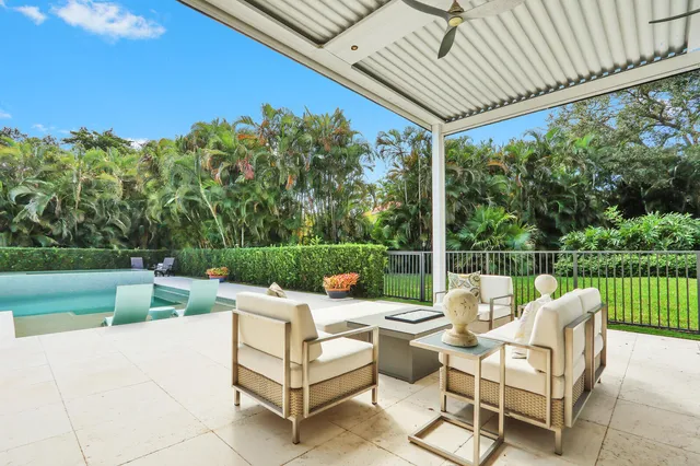 a view of a swimming pool with a patio