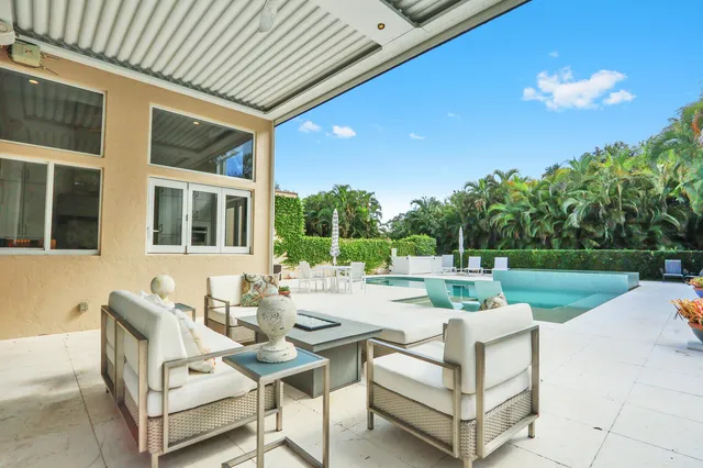 a view of a backyard with sitting area