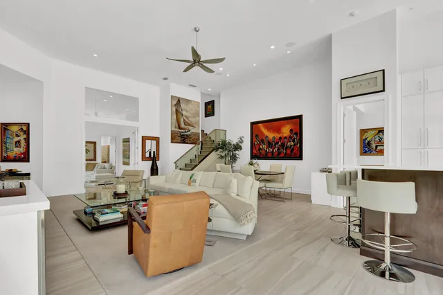a kitchen with stainless steel appliances kitchen island a stove and a refrigerator