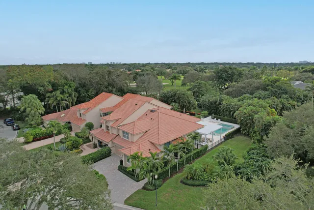 an aerial view of house with yard