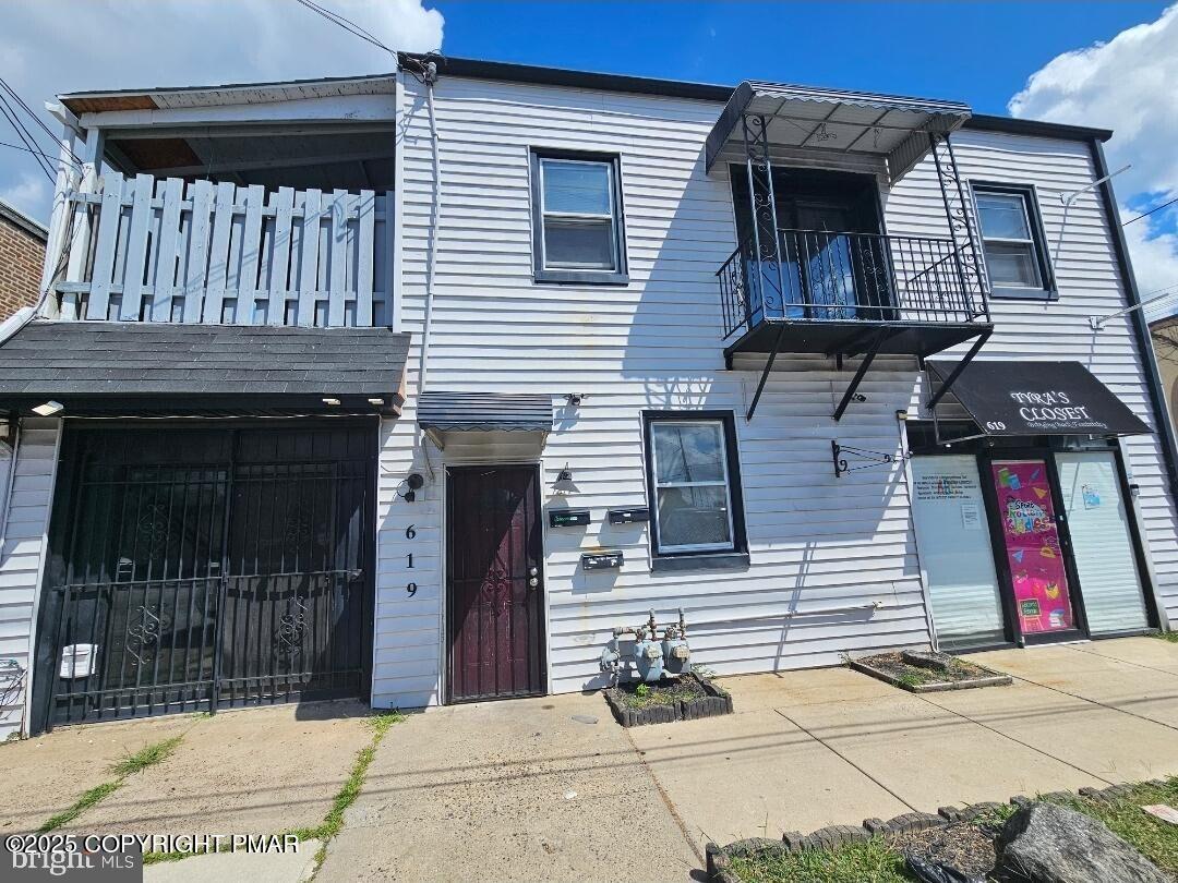 619 Fulton Street Chester, PA 19013 - Photo 2 of 8 a view of a brick house with many windows