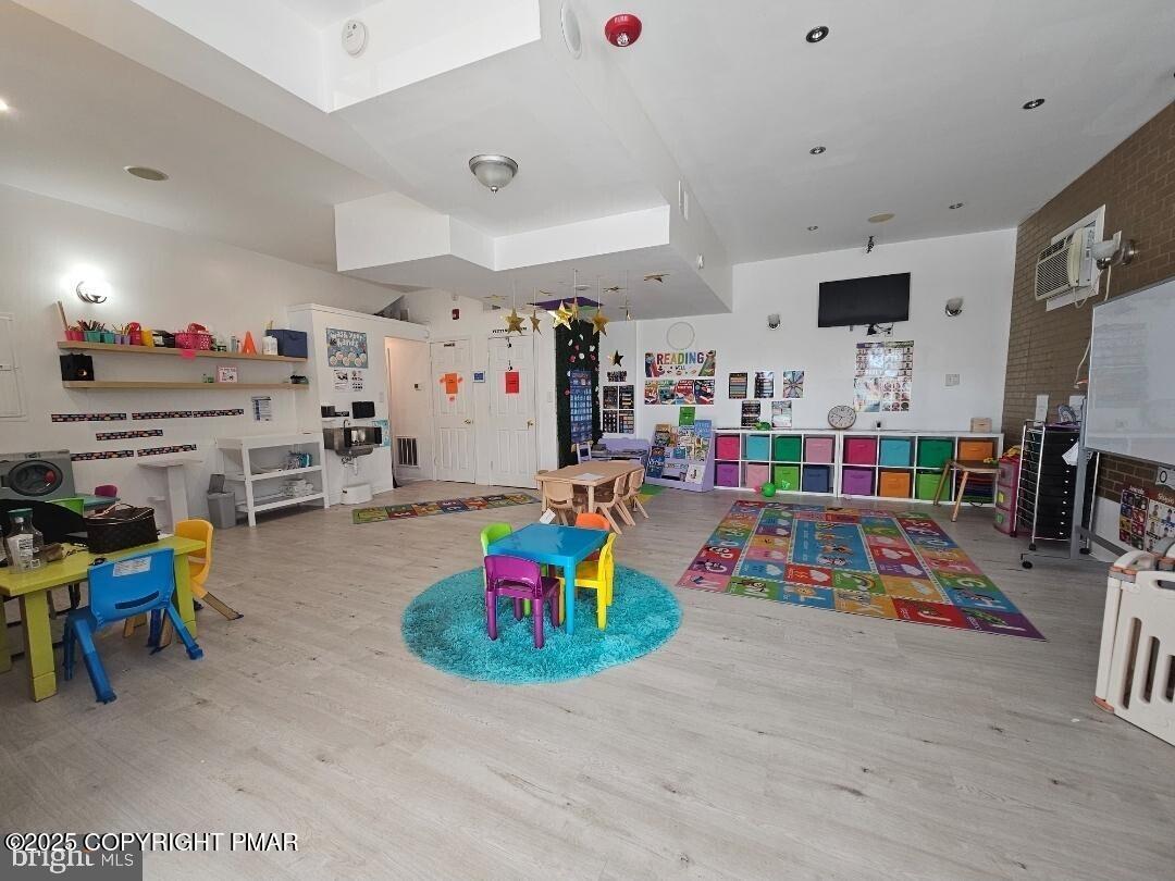 619 Fulton Street Chester, PA 19013 - Photo 3 of 8 a play room with furniture and a flat screen tv
