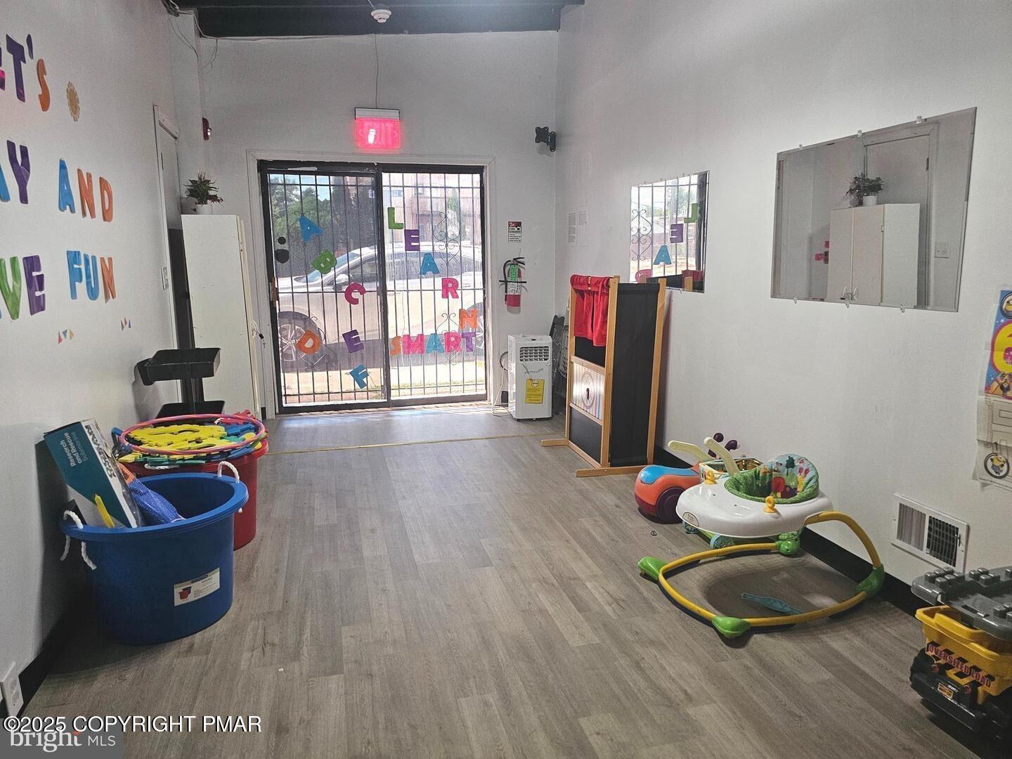 619 Fulton Street Chester, PA 19013 - Photo 6 of 8 a living room with furniture and a window
