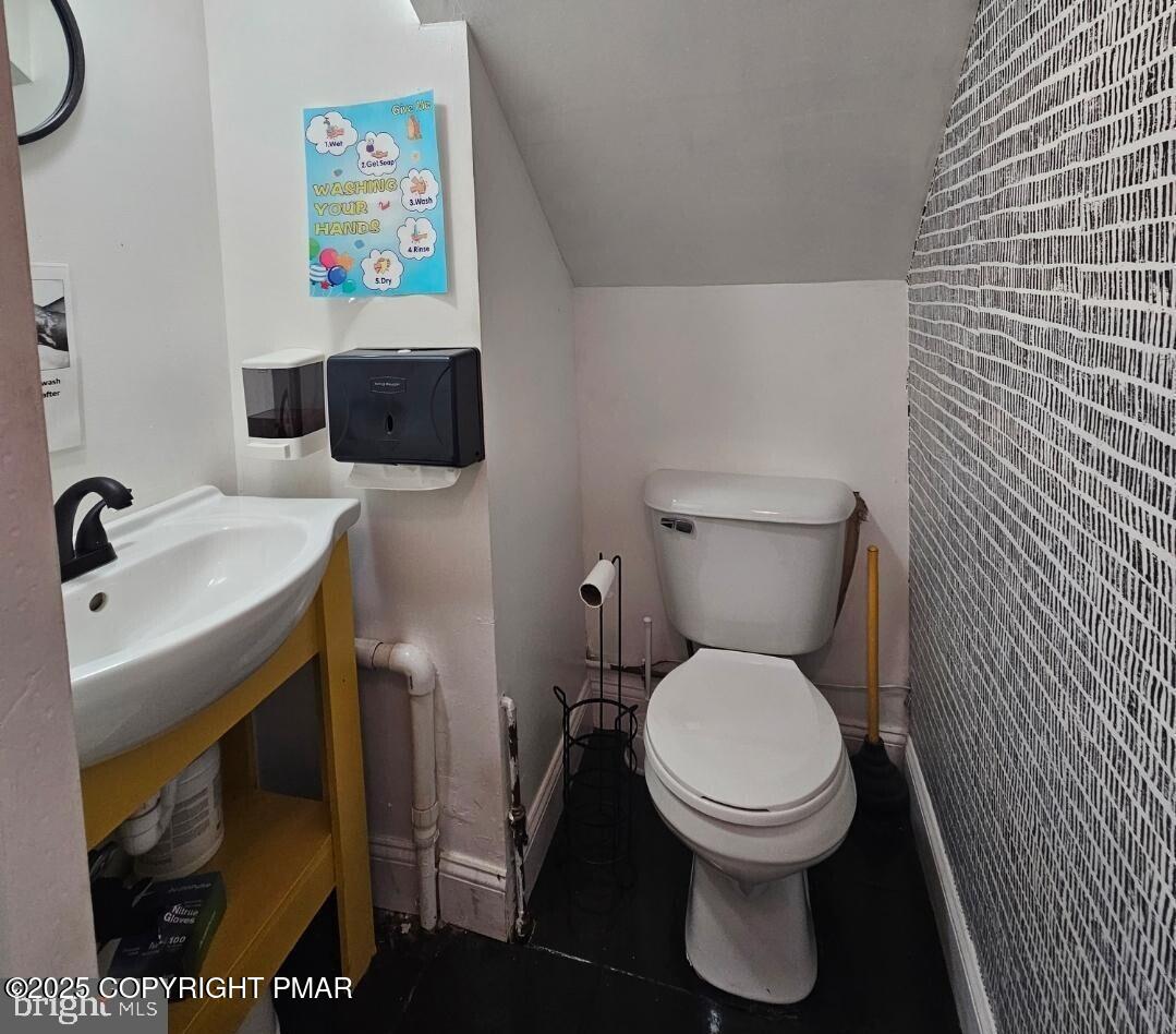 619 Fulton Street Chester, PA 19013 - Photo 8 of 8 a bathroom with a toilet and a sink