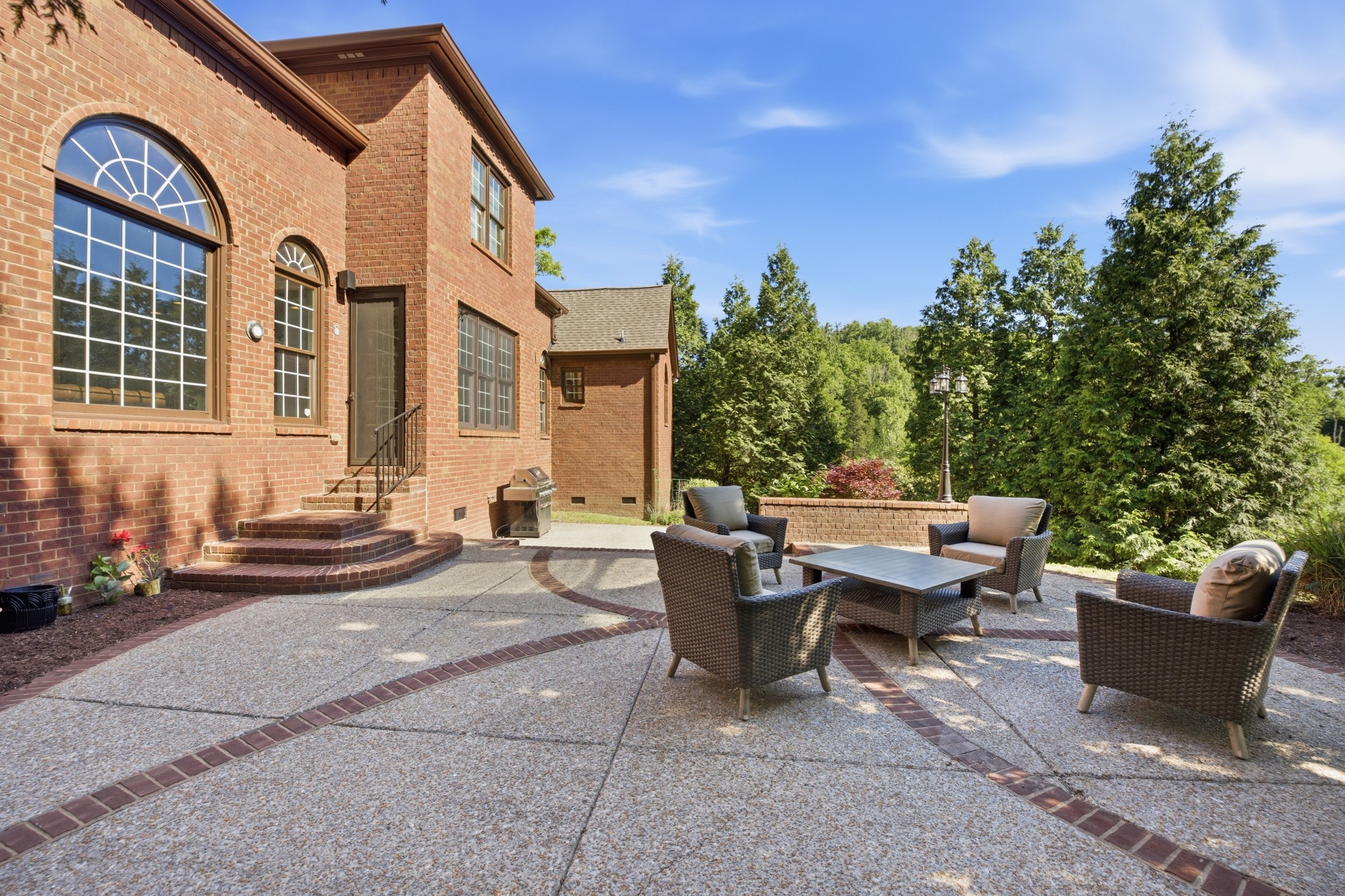 319 Hamlets End Way Franklin, TN 37067 - Photo 50 of 54 a view of a patio with a table and chairs