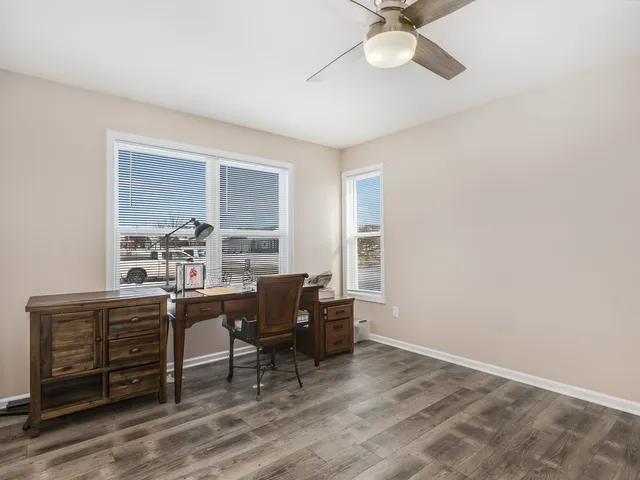 a bathroom with a sink toilet a mirror and vanity