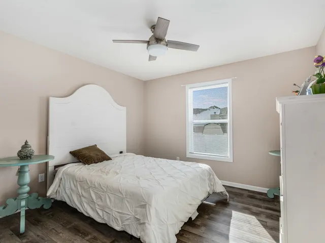 a view of a kitchen with sink and cabinets