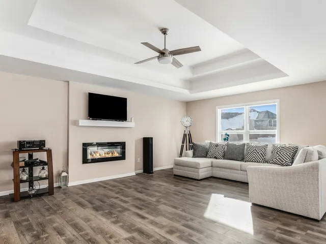 a living room with furniture and a fireplace