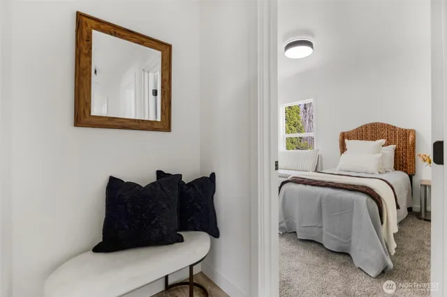 a bed room with a bed and a chair