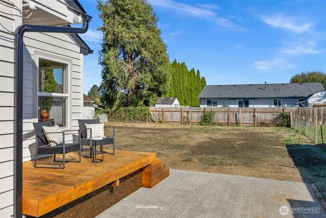 a view of a house with swimming pool and sitting area