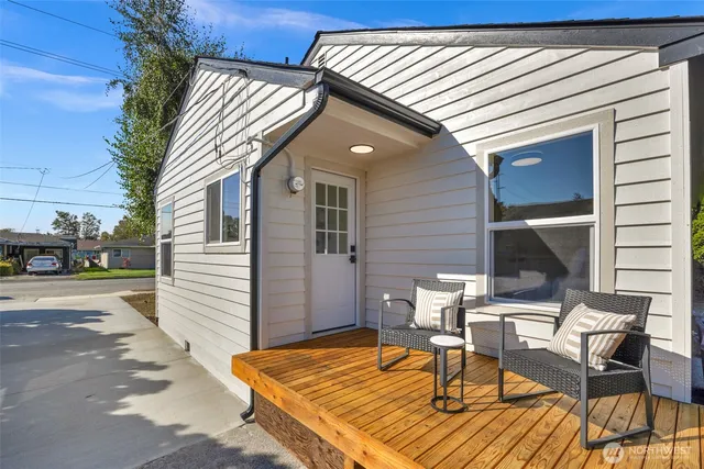 a view of a patio with a table and chairs