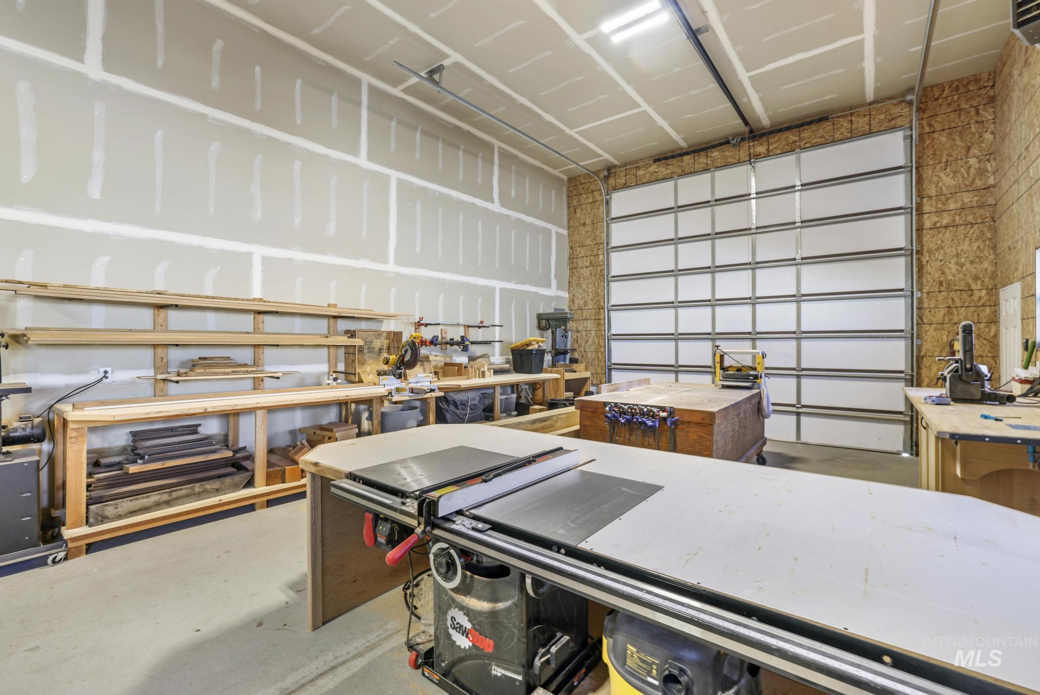 203 North Brush Road Fairfield, ID 83327 - Photo 41 of 50 Garage featuring a workshop area