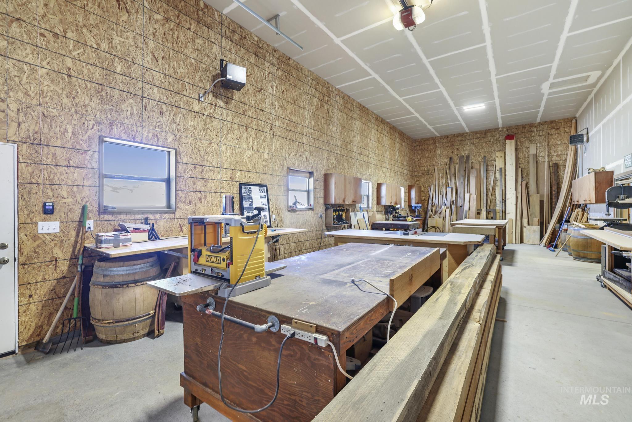 203 North Brush Road Fairfield, ID 83327 - Photo 42 of 50 Miscellaneous room with unfinished concrete flooring and a workshop area