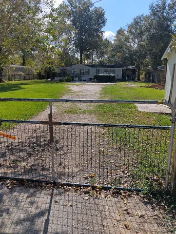a view of a park with large trees