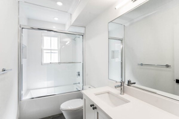 14 Atkins Street, Unit 2 Boston, MA 02135 - Photo 5 of 11 a bathroom with a sink toilet and shower