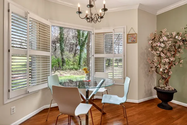 a kitchen with stainless steel appliances granite countertop wooden cabinets a stove top oven a sink and dishwasher