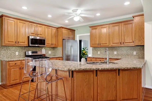 a kitchen with sink cabinets and window