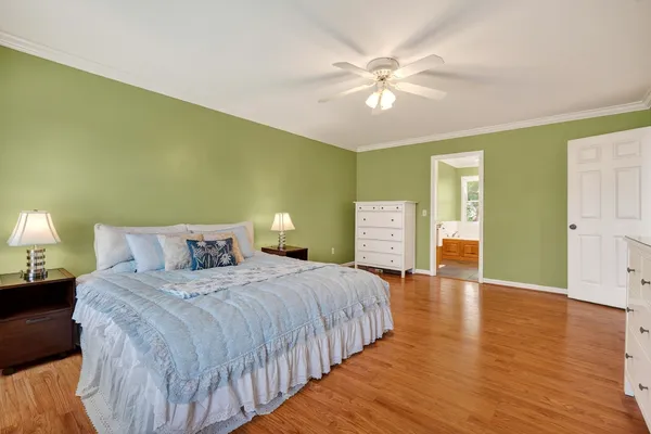 a bathroom with a granite countertop sink a mirror and a shower