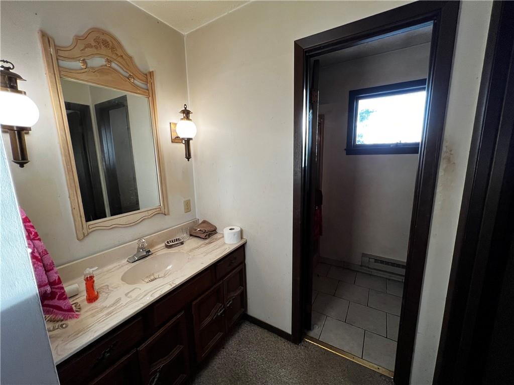 177 Bute Road Uniontown, PA 15401 - Photo 11 of 15 a bathroom with a sink and a mirror