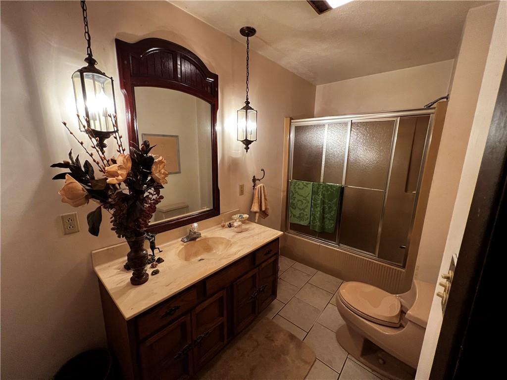 177 Bute Road Uniontown, PA 15401 - Photo 12 of 15 a bathroom with a sink a toilet and shower