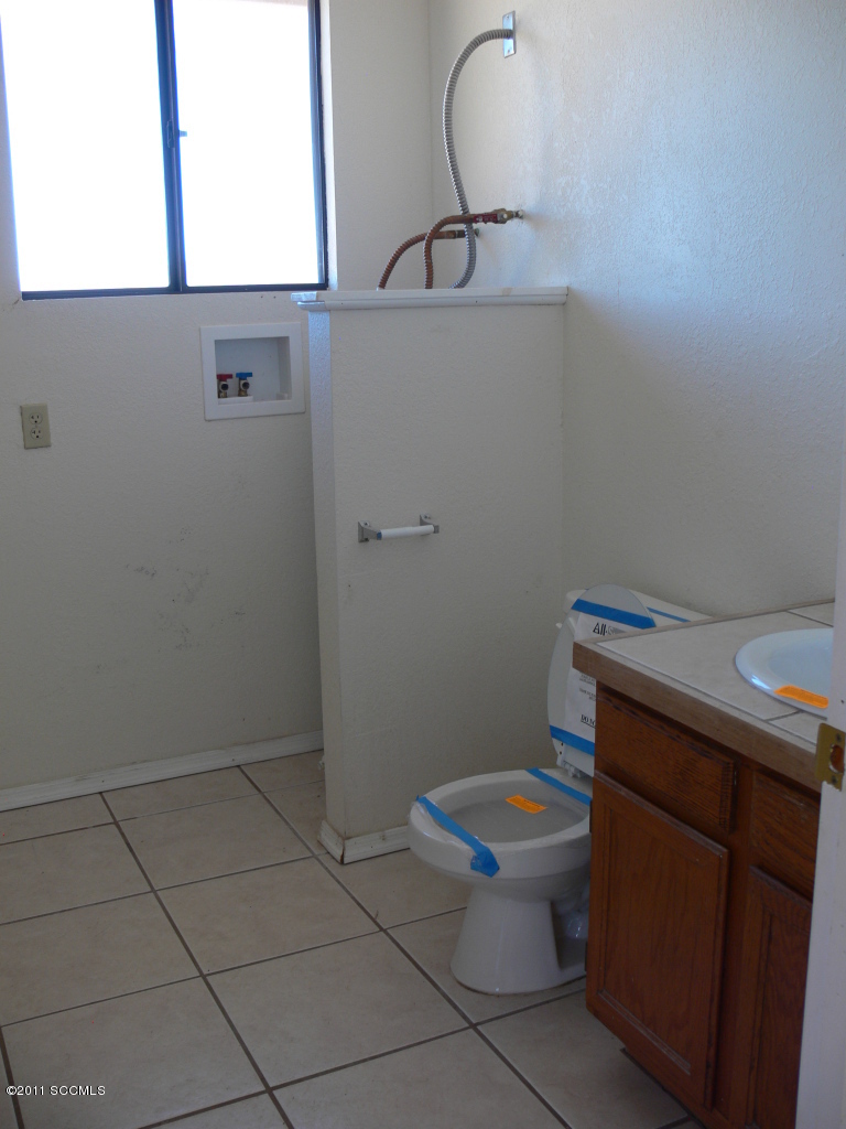 929 Via Puebla Rio Rico, AZ 85648 - Photo 10 of 13 a bathroom with a toilet and a sink