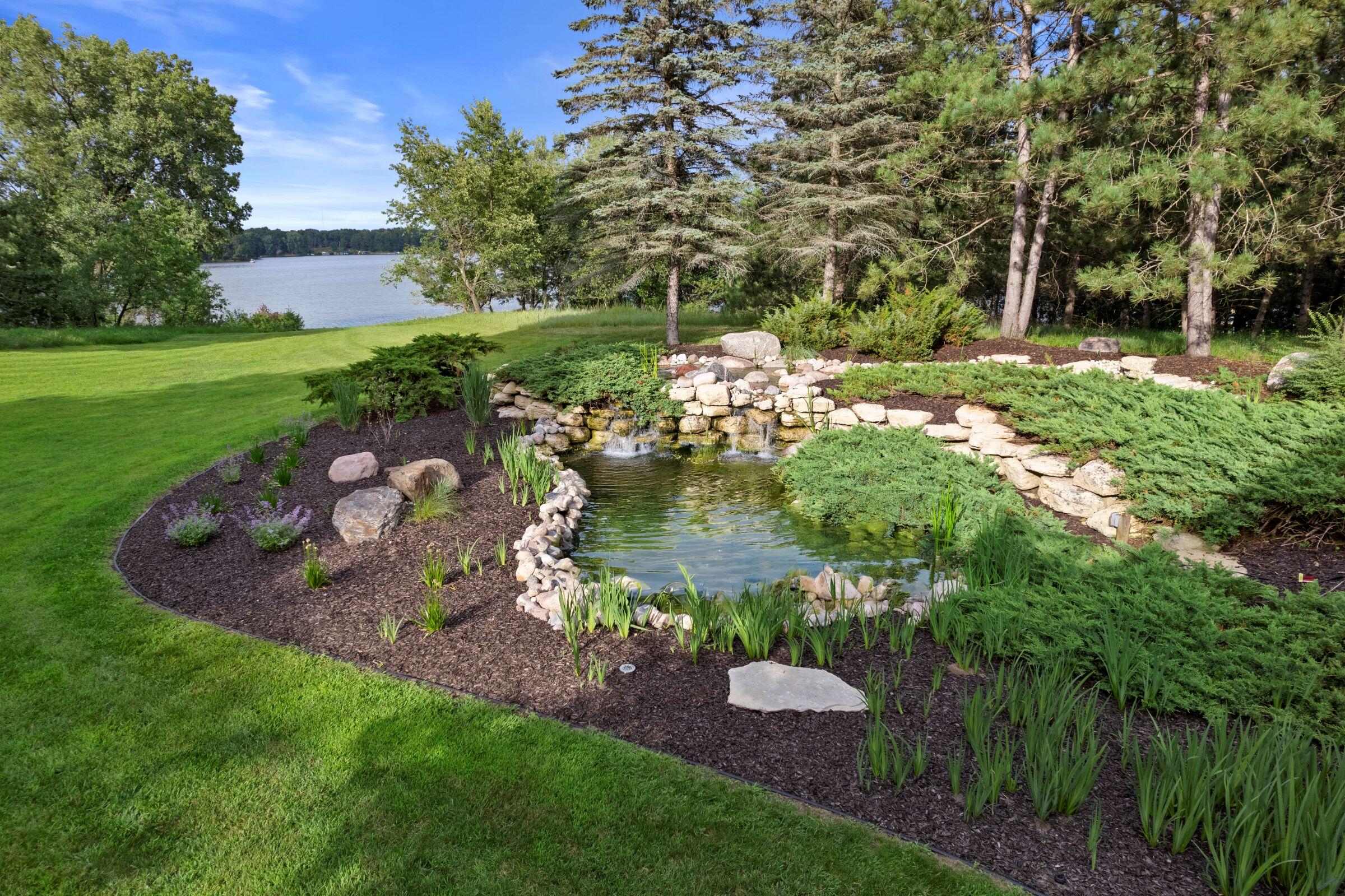 1472 Council Hill Trail Rome, WI 54457 - Photo 6 of 86 Peaceful Pond with Waterfall