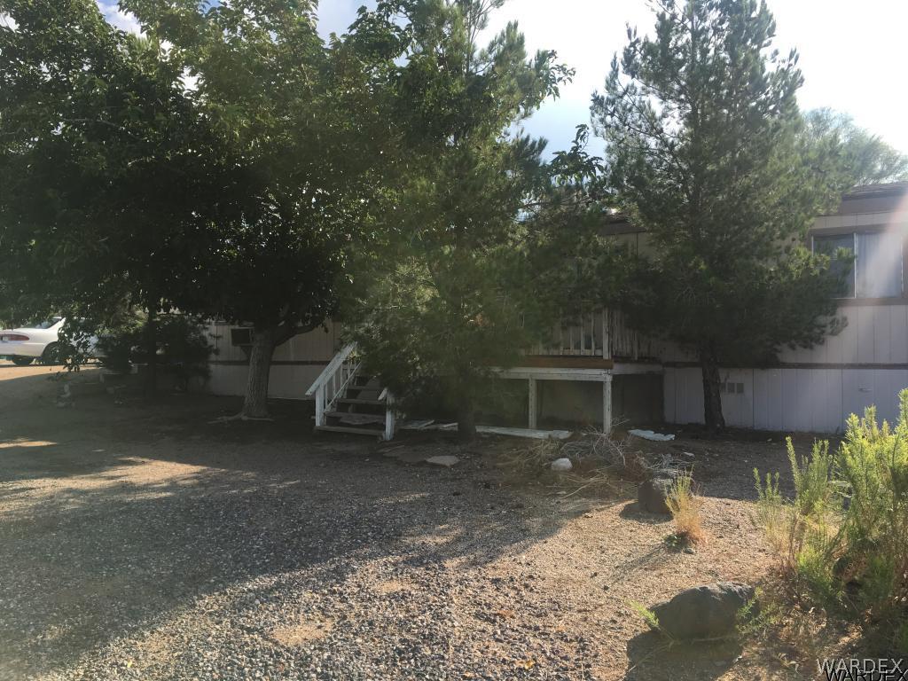 490 Kelvin Road Golden Valley, AZ 86413 - Photo 1 of 2 a view of a house with a yard