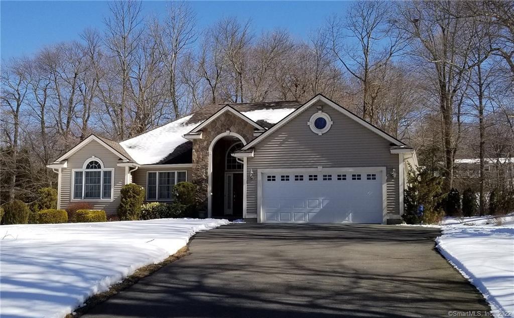 585 Wolcott Road Bristol, CT 06010 - Photo 1 of 1 a front view of a house with a yard and garage