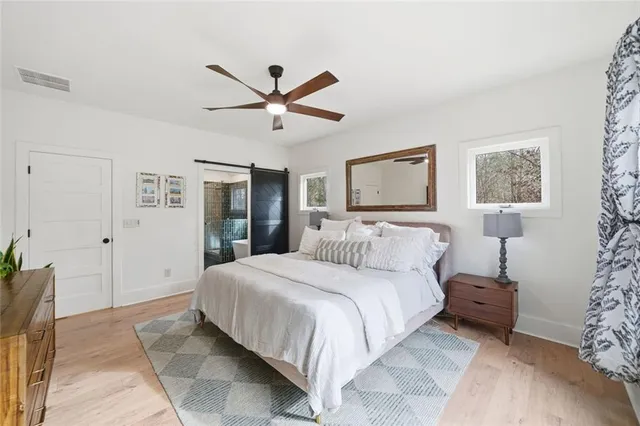 a bathroom with a double vanity sink mirror and bathtub