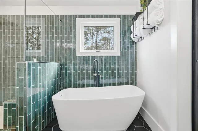 a bathroom with a toilet and shower