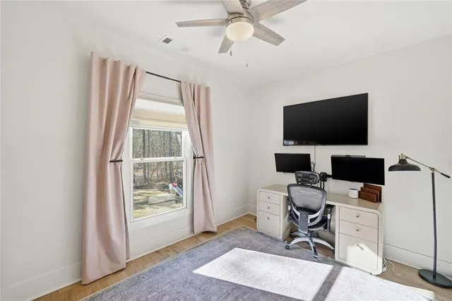 a bedroom with furniture and a window