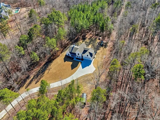 a view of a house with snow on the background