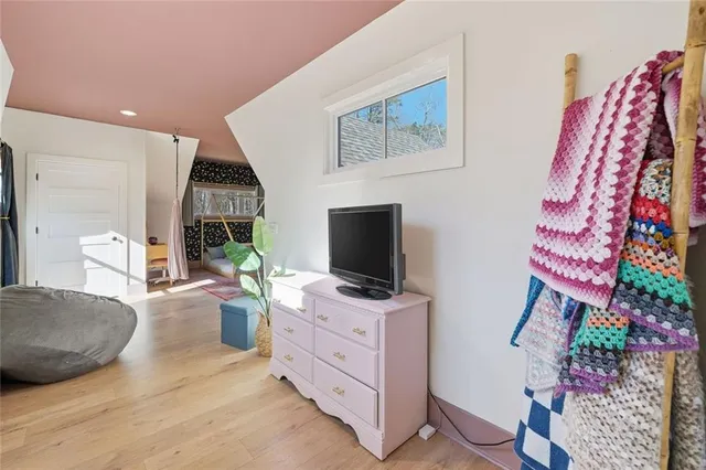 wooden floor in an empty room with a fireplace
