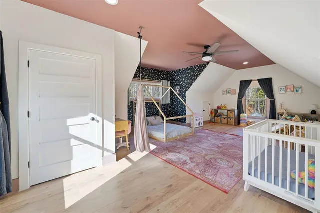 a living room with patio furniture and a large window