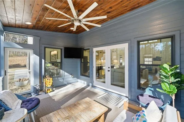 a backyard of a house with table and chairs