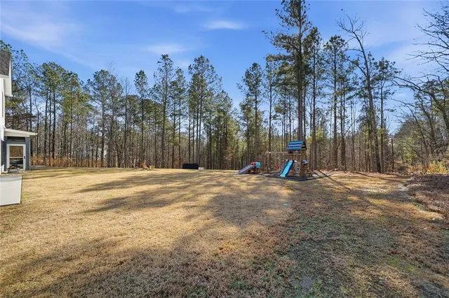 a front view of a house with yard