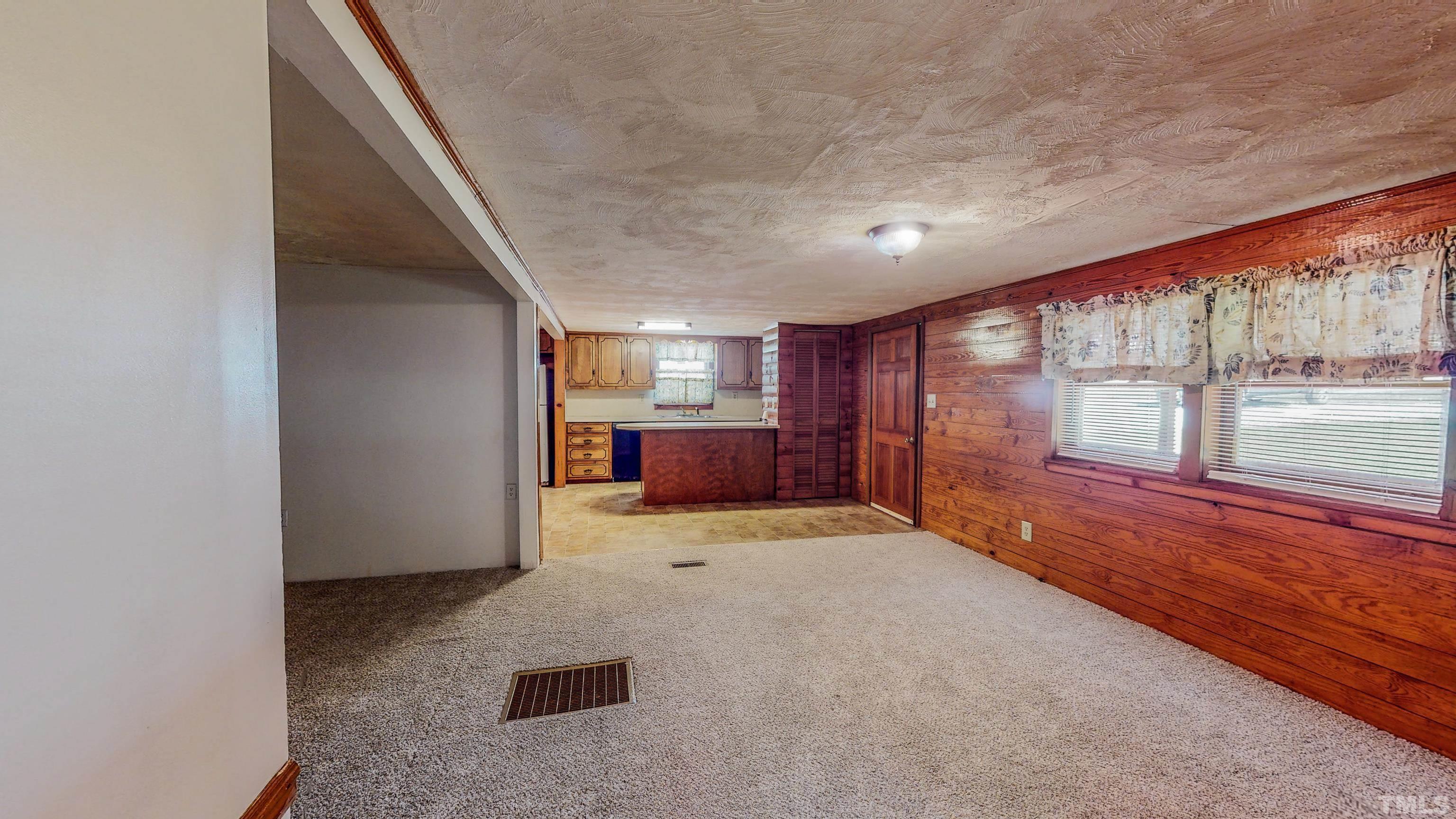 358 Gravitte Road Roxboro, NC 27573 - Photo 21 of 35 a view of an empty room with a window