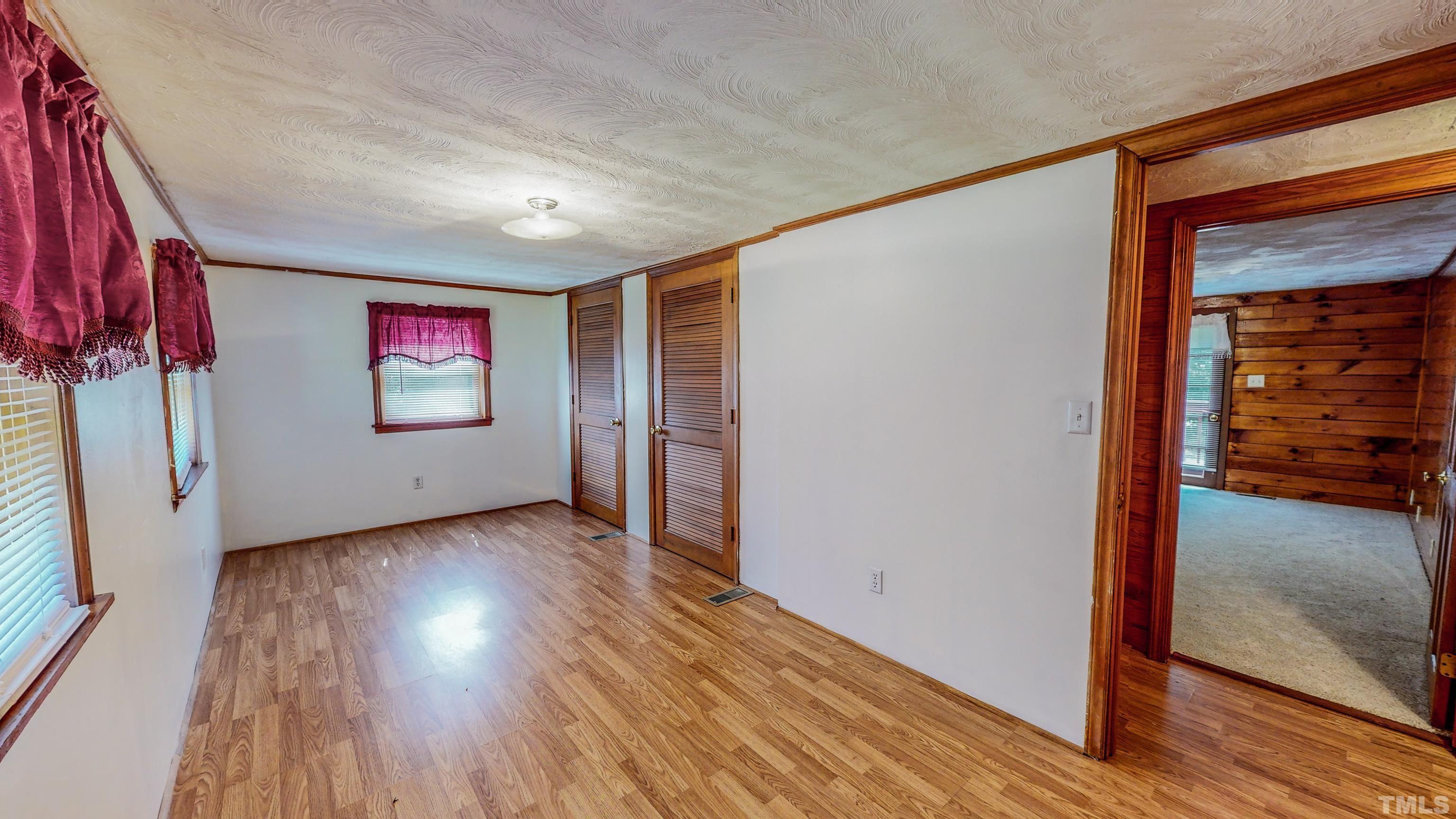 358 Gravitte Road Roxboro, NC 27573 - Photo 23 of 35 wooden floor in an empty room with a window
