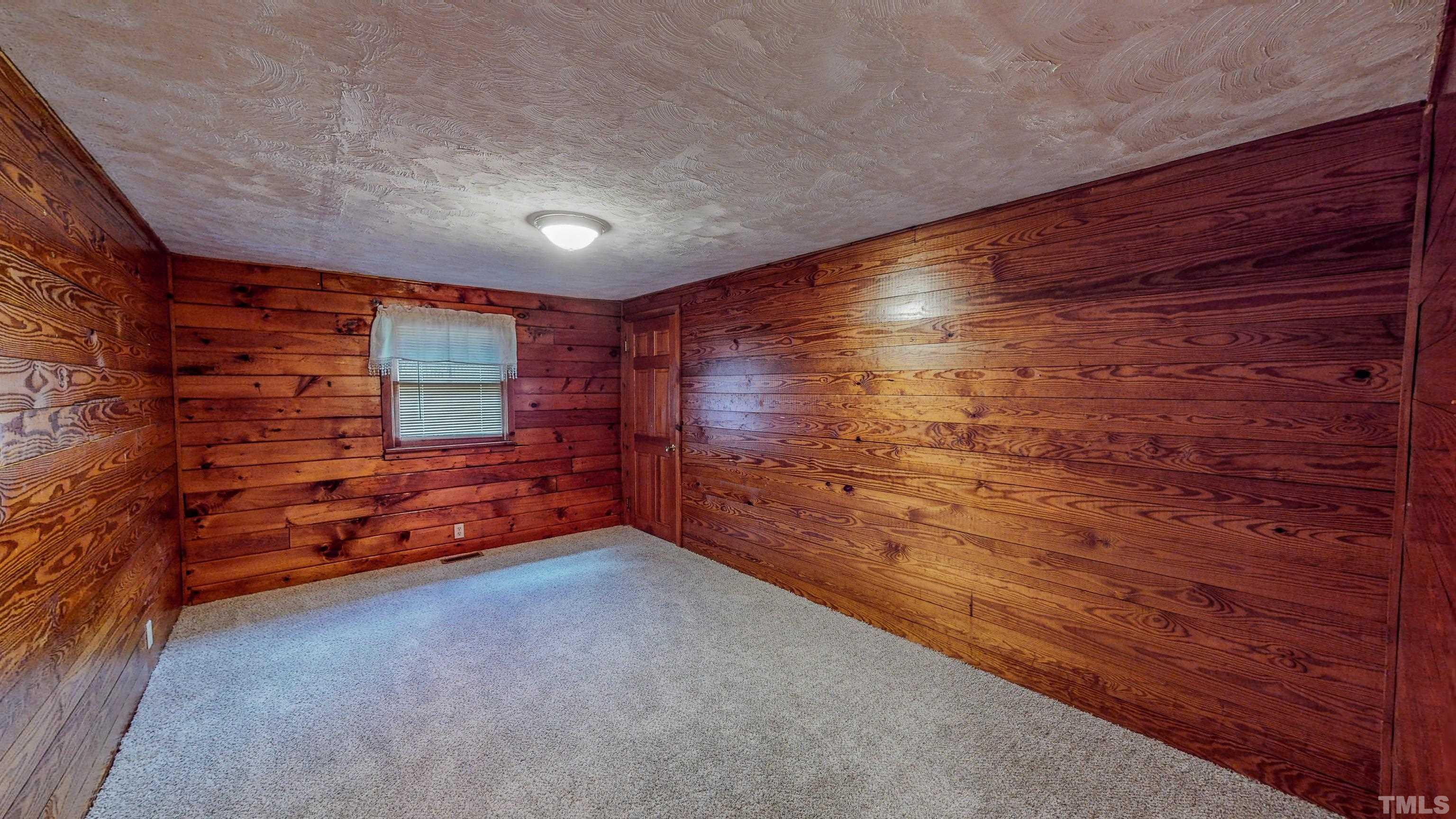 358 Gravitte Road Roxboro, NC 27573 - Photo 25 of 35 a big room with wooden walls