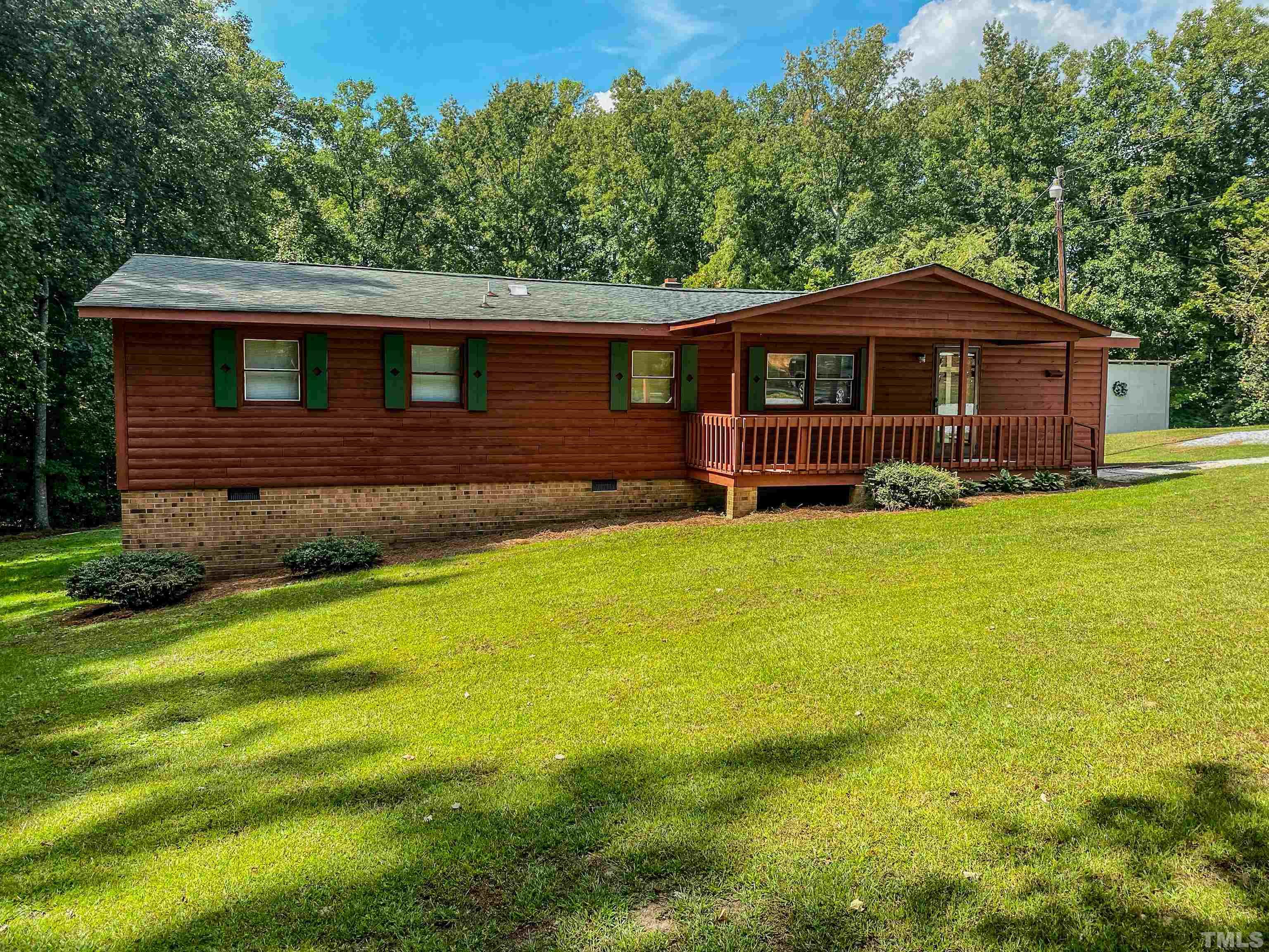 358 Gravitte Road Roxboro, NC 27573 - Photo 29 of 35 a front view of a house with a yard