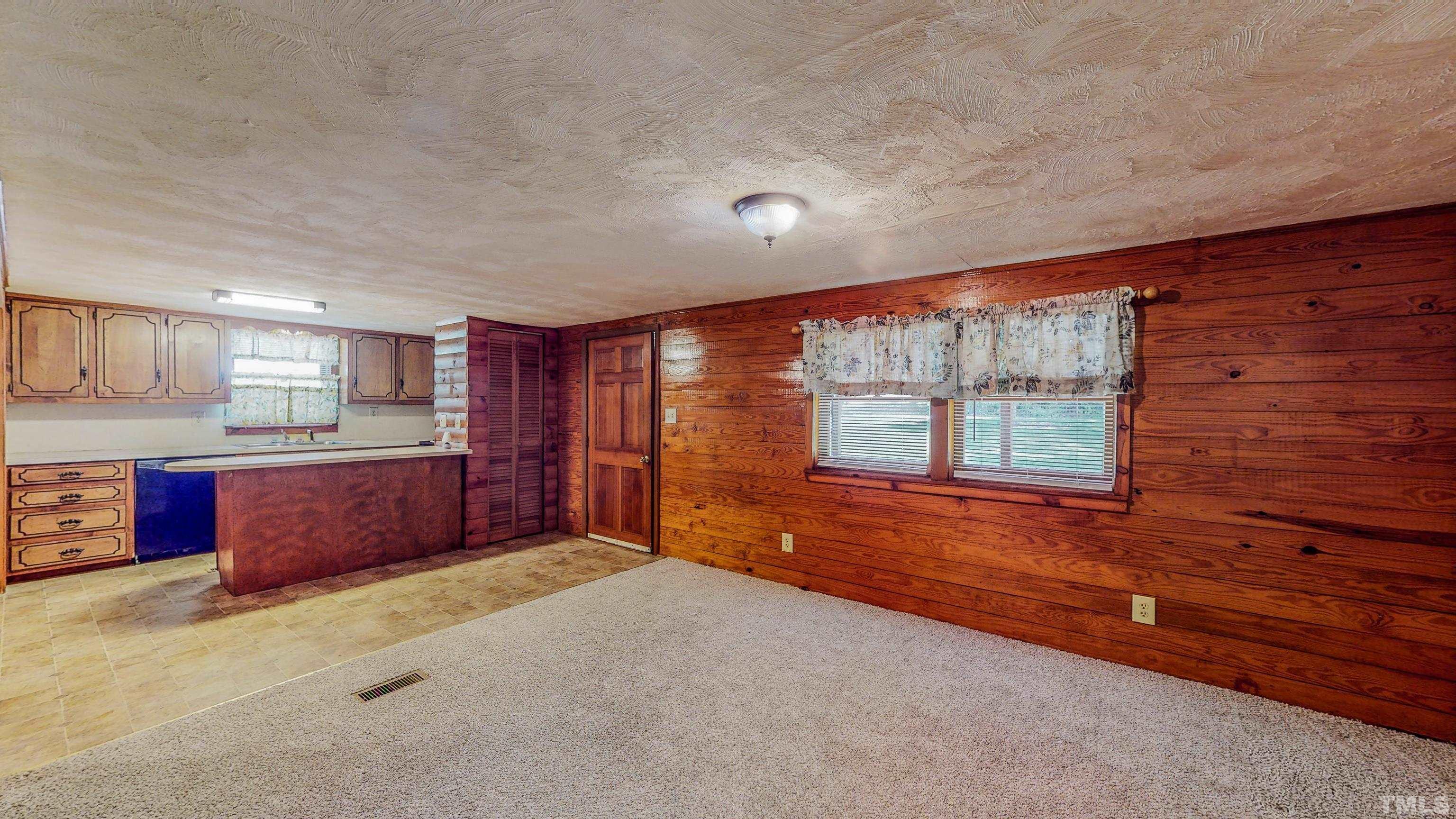 358 Gravitte Road Roxboro, NC 27573 - Photo 7 of 35 a spacious bedroom with a large bed and window