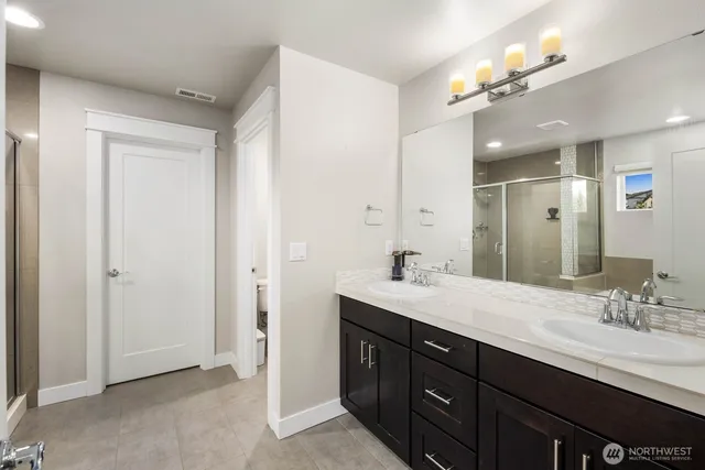 a bathroom with a tub and shower