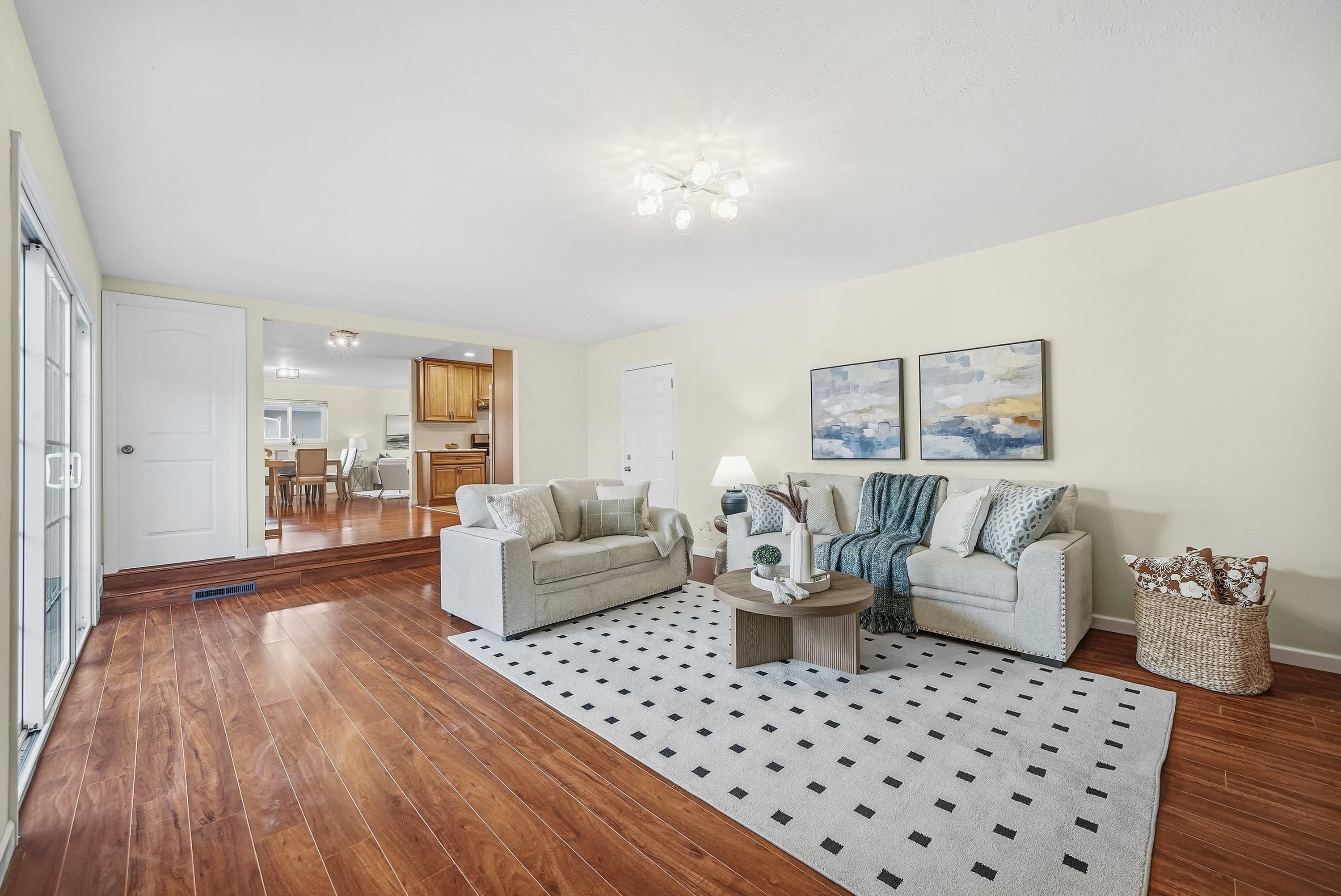 4214 Wells Street Pleasanton, CA 94566 - Photo 17 of 38 a living room with furniture and a wooden floor