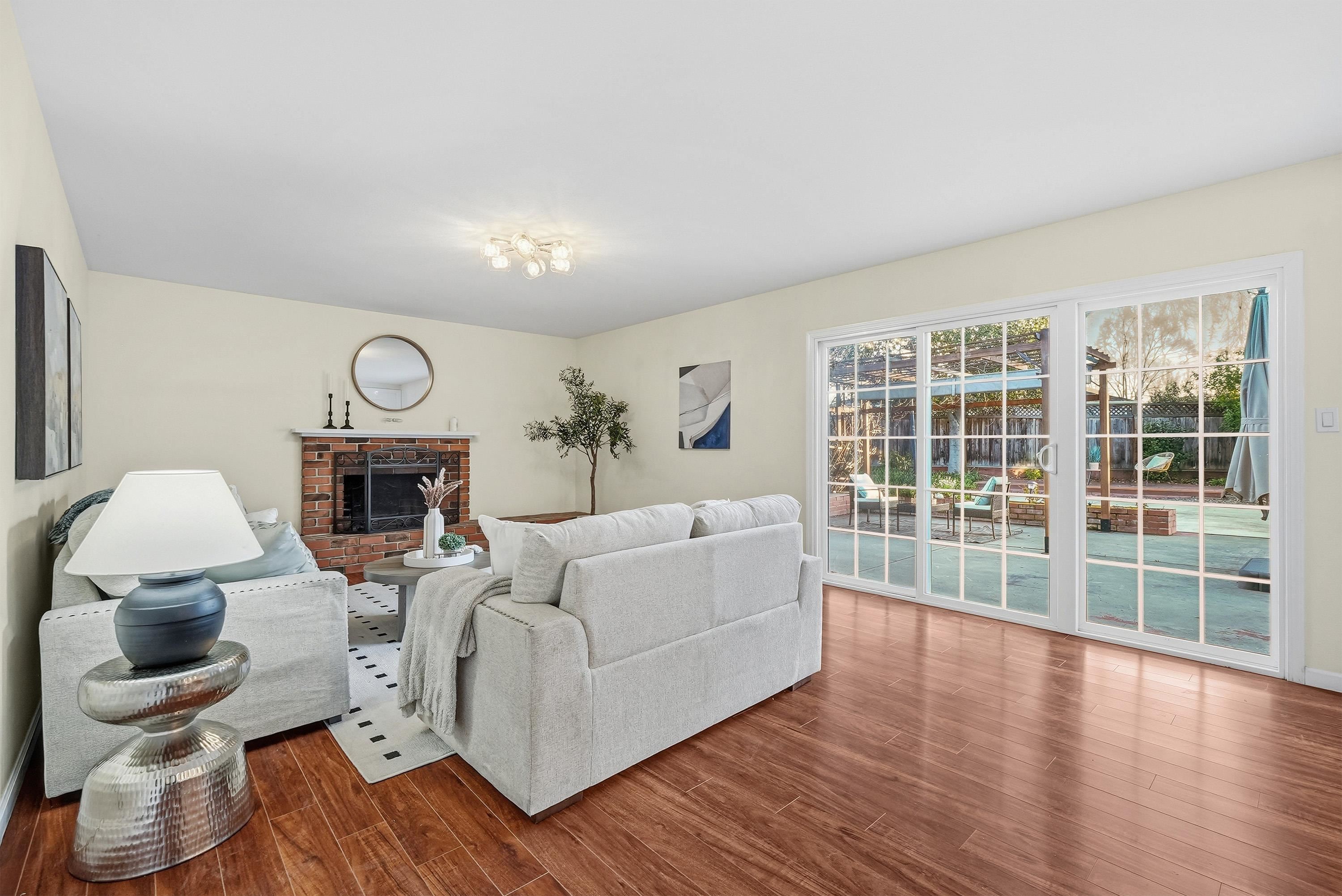 4214 Wells Street Pleasanton, CA 94566 - Photo 19 of 38 a living room with furniture and a fireplace