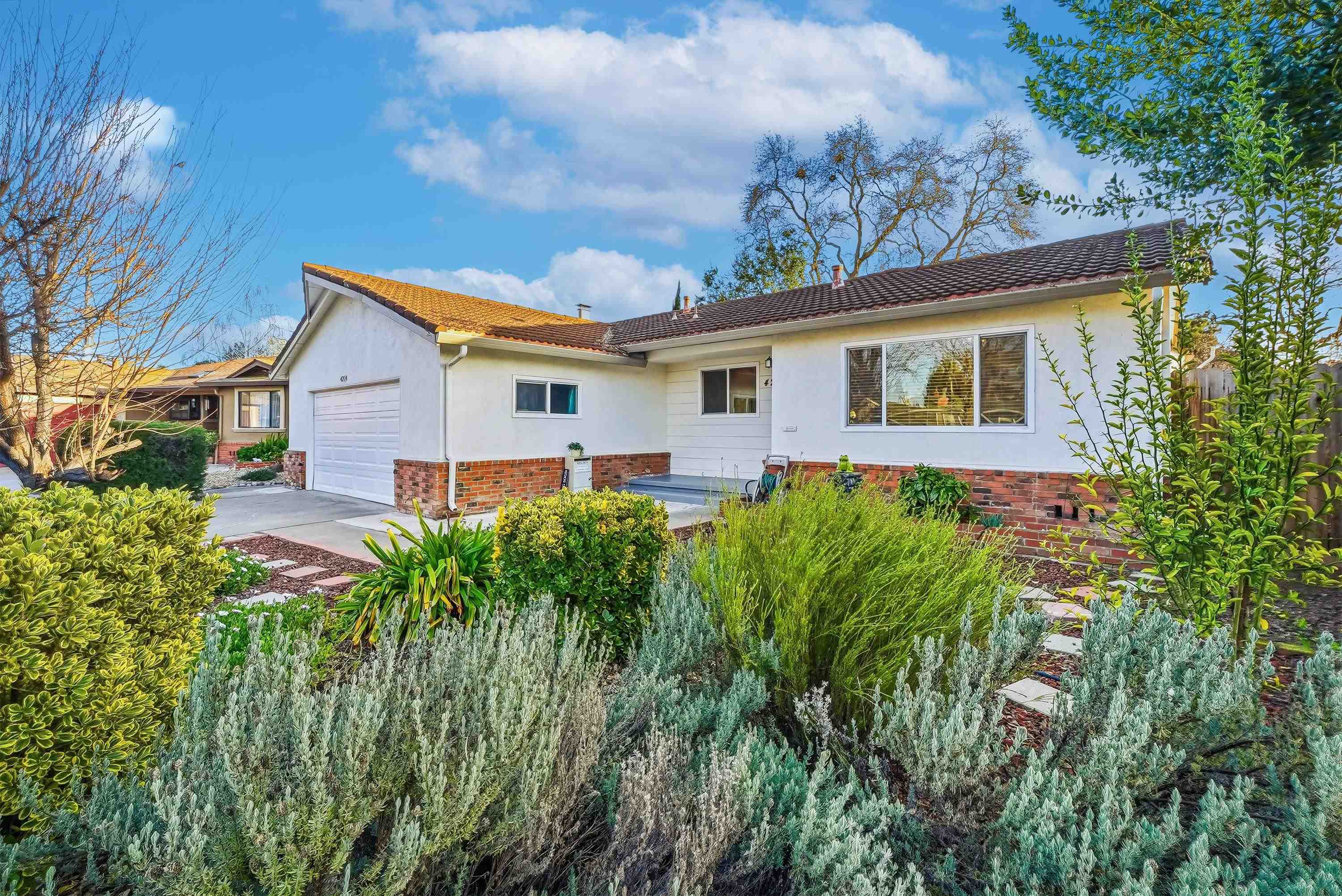 4214 Wells Street Pleasanton, CA 94566 - Photo 2 of 38 a view of a house with a big yard and potted plants