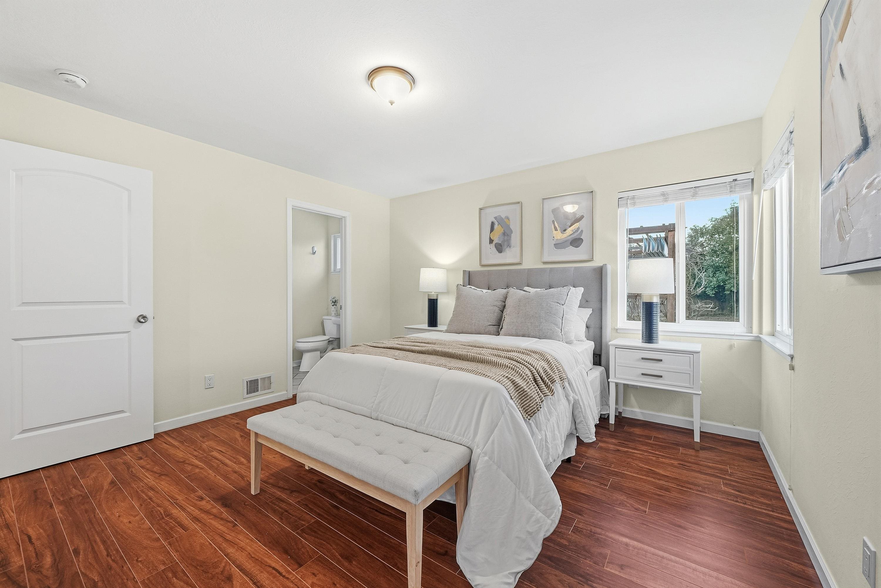 4214 Wells Street Pleasanton, CA 94566 - Photo 22 of 38 a bedroom with a bed and wooden floor