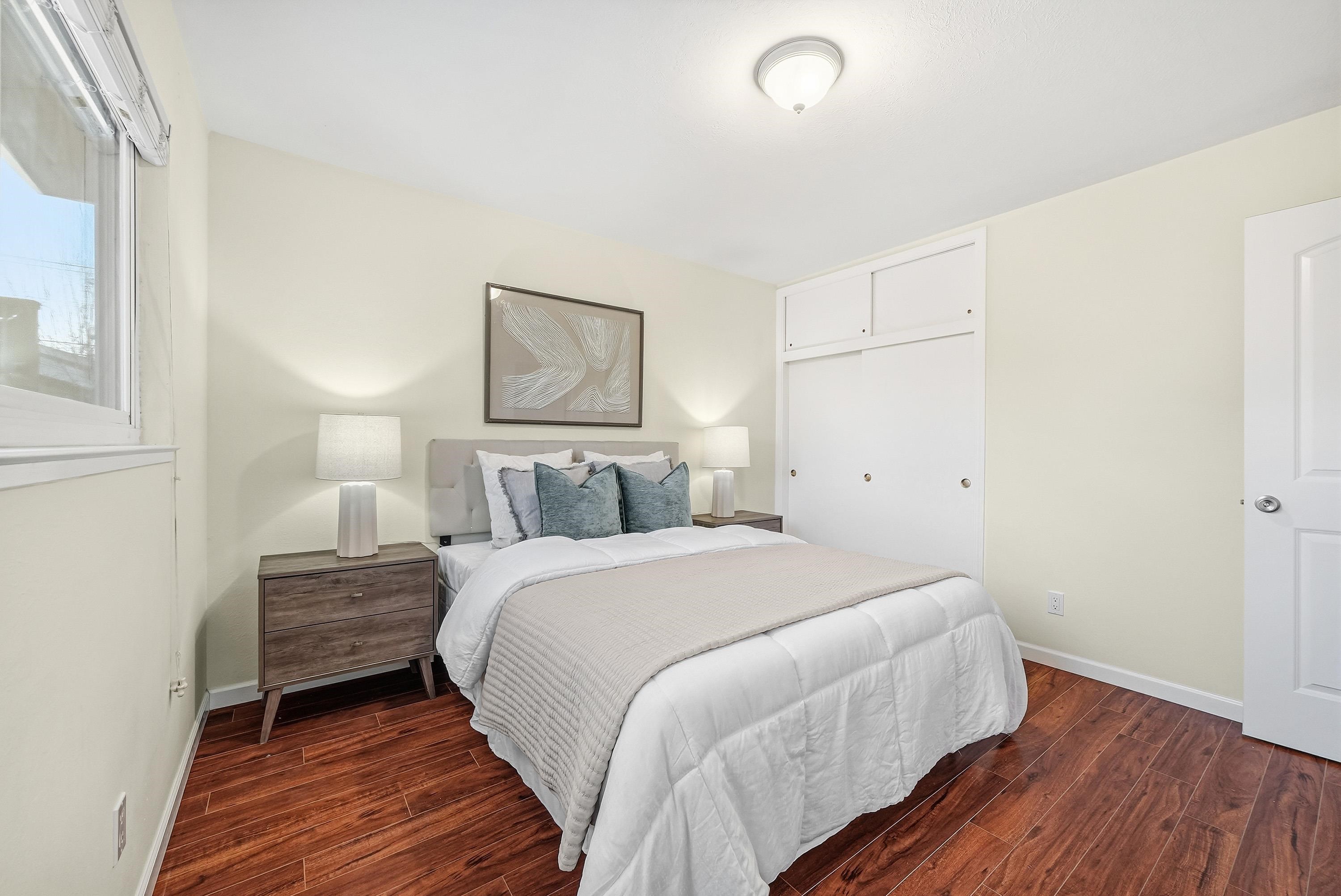 4214 Wells Street Pleasanton, CA 94566 - Photo 25 of 38 a bedroom with a bed and a painting on the wall