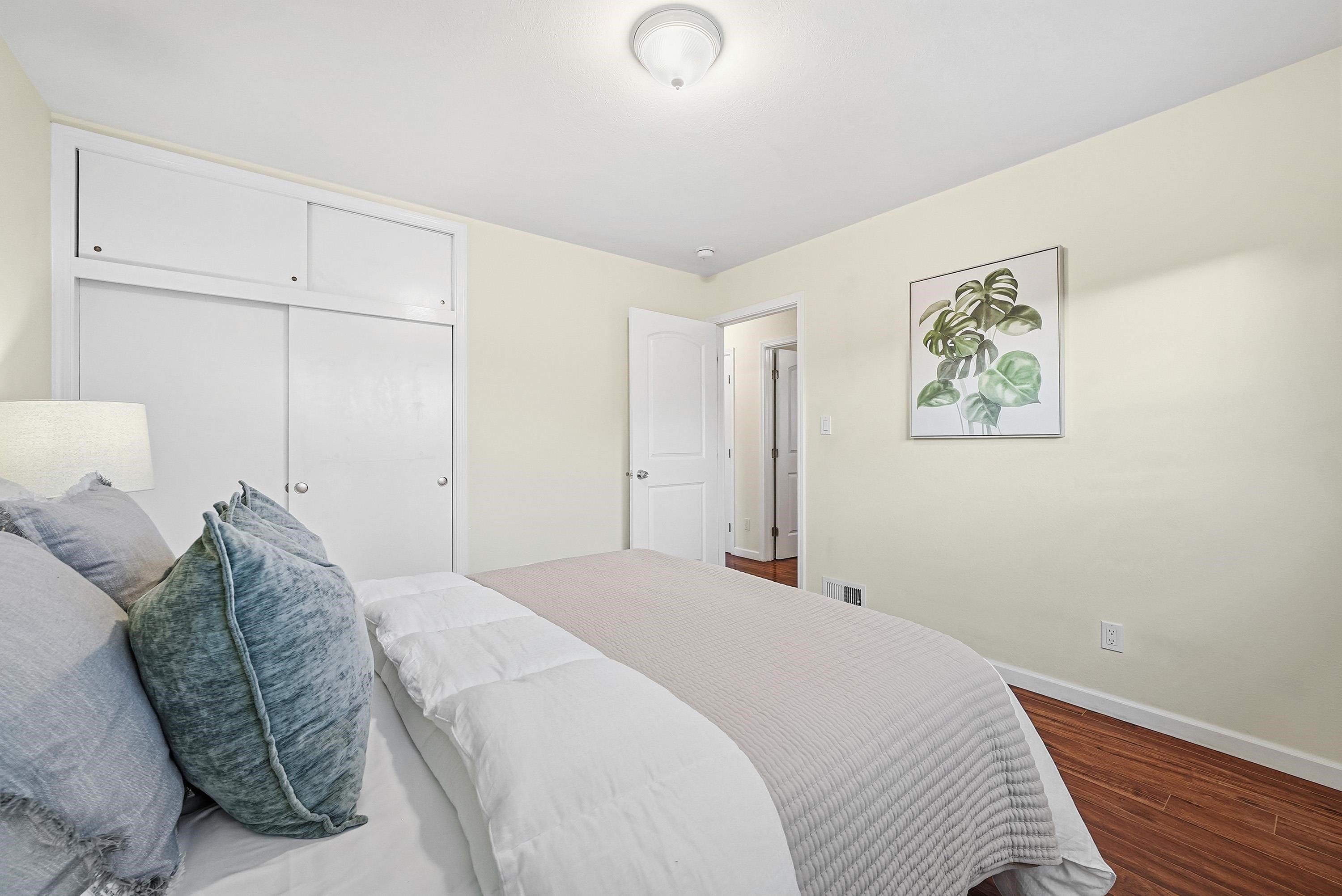 4214 Wells Street Pleasanton, CA 94566 - Photo 27 of 38 a bedroom with a bed and a painting on the wall