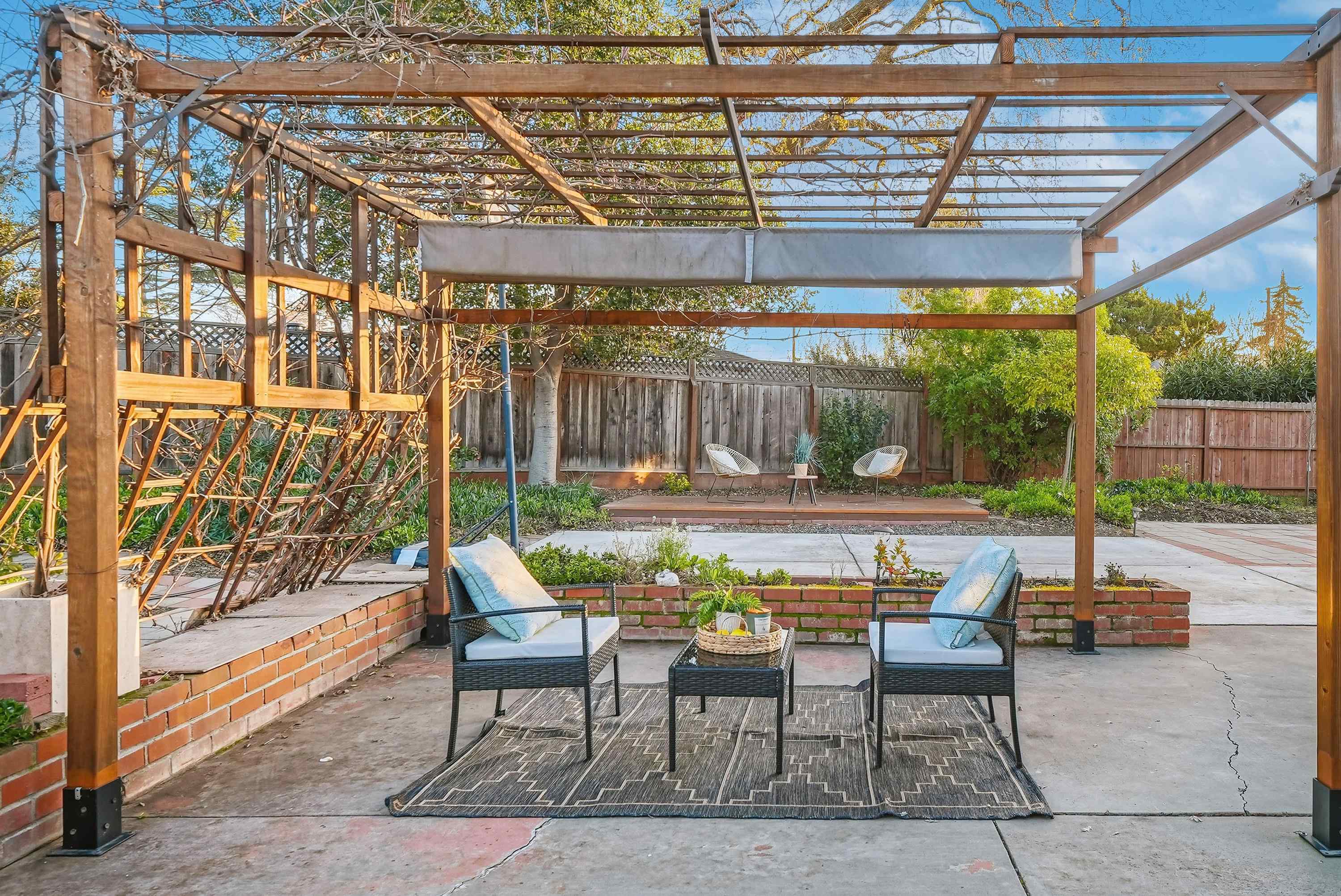 4214 Wells Street Pleasanton, CA 94566 - Photo 34 of 38 a patio with glass top table and chairs