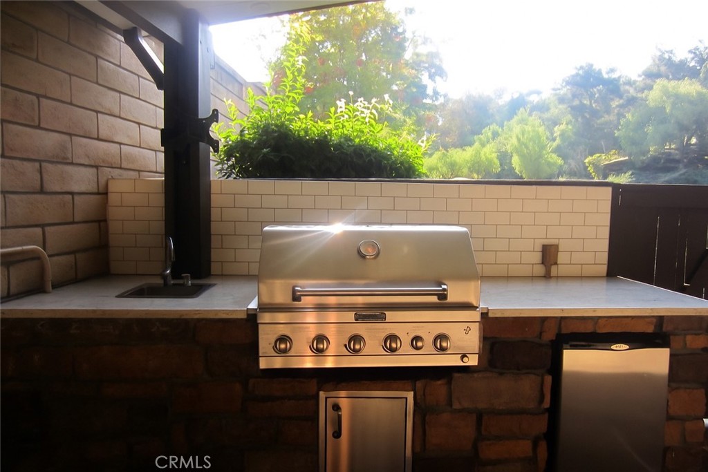 8000 East Snapdragon Lane Anaheim Hills, CA 92808 - Photo 13 of 27 a view of a stove with two chairs